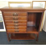 An Edwardian mahogany music cabinet fitted with six drawers.