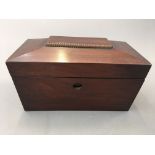 A mahogany tea caddy, with glass vase to interior.