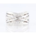 *A diamond set cross over design ring, two bands of the cross over design set with round brilliant