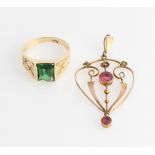 An early 20th Century red paste open metalwork pendant, stamped 9ct, together with a gents green