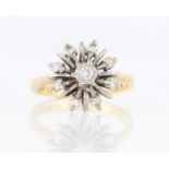 A diamond set star design ring, set with a central round brilliant cut diamond, measuring approx.