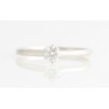 A diamond solitaire ring, set with a round brilliant cut diamond, measuring approx. 0.50ct,