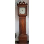 Oak cased clock with fluted columns and painted face.