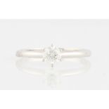 A diamond solitaire ring, set with a round brilliant cut diamond, measuring approx. 1ct, stamped