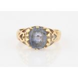 A sapphire single stone ring, with open metalwork shoulders, stamped 18ct, ring size L.