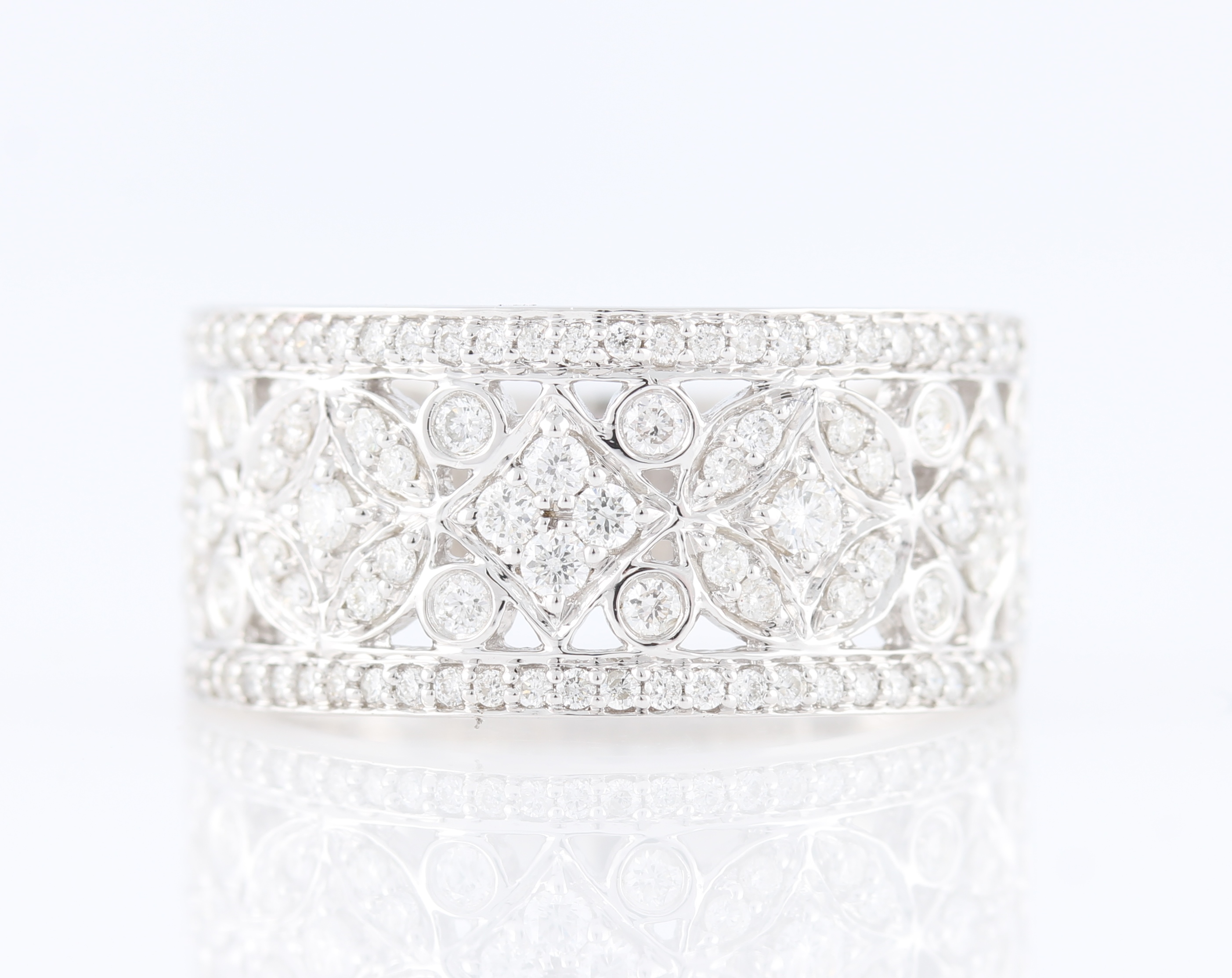 *A diamond set ring, set with round cut diamonds to open metalwork design band, white metal