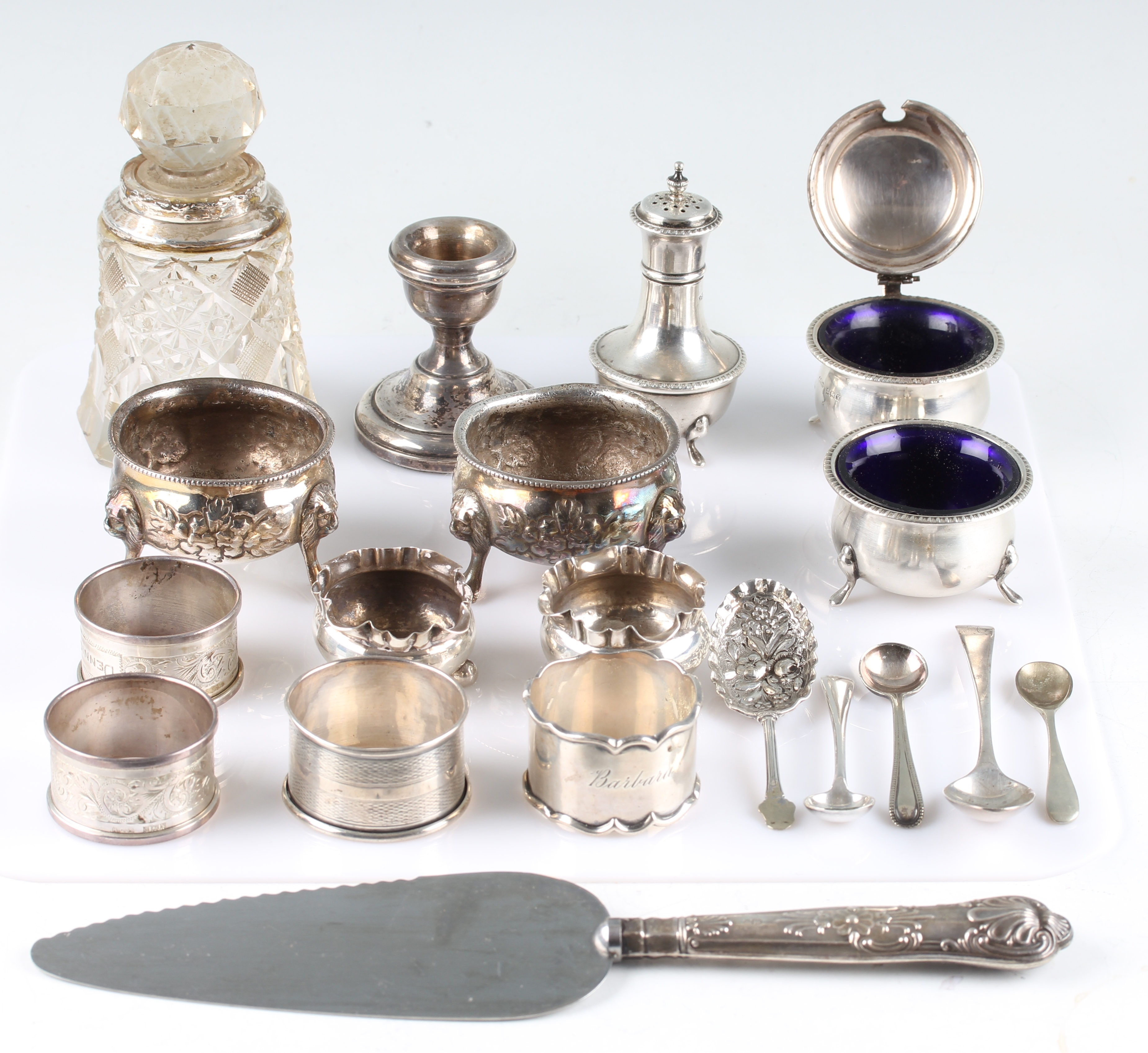 A collection of hallmarked silverware, to include four napkin rings, a Georgian tea spoon, two