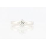 An 18ct white gold diamond solitaire ring, set with a round brilliant cut diamond, measuring approx.