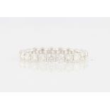 *A diamond full eternity ring, set with 23 round brilliant cut diamonds, total diamond weight