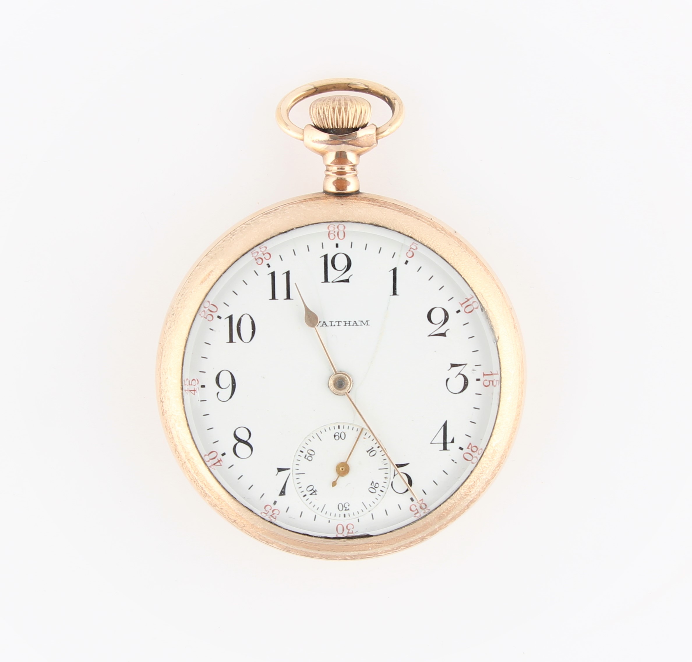 A gold plated Waltham open face crown wind pocket watch, the white enamel dial having hourly