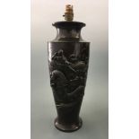 A bronze lamp base with oriental dragon design, height approximately 45cm.