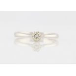 An 18ct white gold diamond solitaire ring, set with a round brilliant cut diamond, measuring approx.