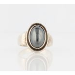 A Georg Jensen hematite ring, set centrally with an oval cut hematite cabochon, design no. 46,