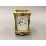 A small carriage clock, height 14cm.