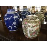 Two ginger jars, one blue and white blossom design, AF, height 35cm, and a Famille rose with six cha