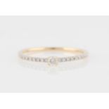 *A diamond ring, set with a principal round brilliant cut diamond, measuring approx. 0.07ct, with