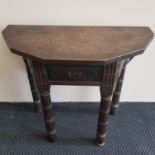 A late 17th - early 18th century oak single leaf table with gun barrel turner legs with a later