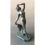 An Art Deco blue painted chalk semi-clad female with apple figurine, height 39cm, width 12cm.