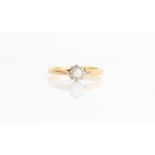 A hallmarked 18ct yellow gold diamond solitaire ring, set with a round brilliant cut diamond