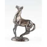 A silver model of a horse by Lorne McKean, with signature and hallmarked London import 1975,