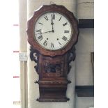 A rosewood cased with specimen wood inlay round faced wall clock with Roman