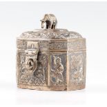 An Indian white metal trinket box, featuring repousse animal design to body and lid, with cast