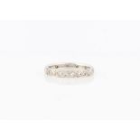 A hallmarked 18ct white gold diamond full eternity ring, set with eight cut diamonds, ring size M.