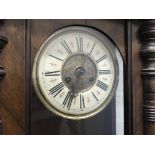 Two clocks, one walnut Vienna and one Tempus Fugit hall clock.