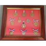 A framed and glazed collection of Queen Victoria Jubilee medals.