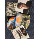 A collection of LP records, including The Police, The Rolling Stones, Michael Jackson, ELO, John