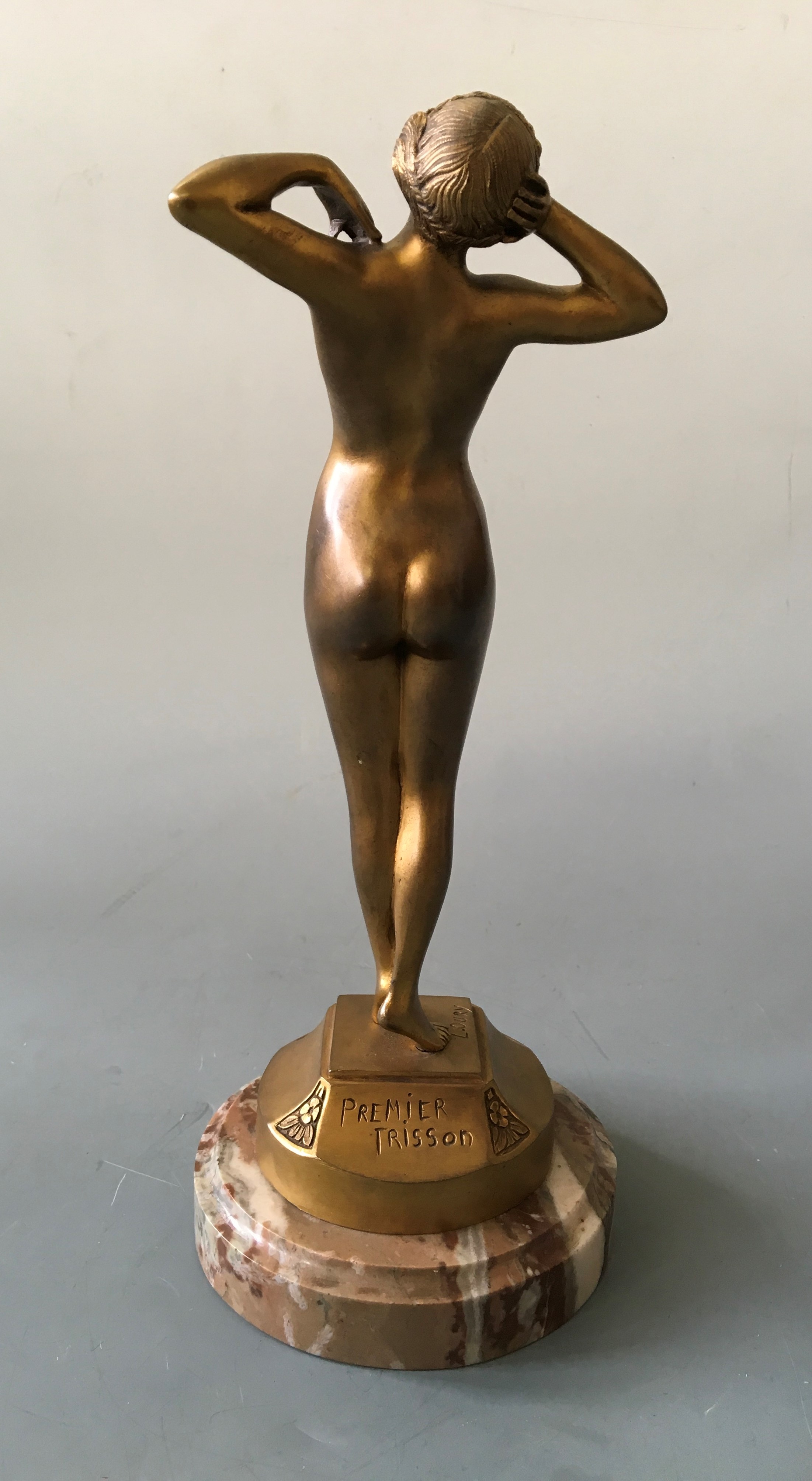 L. OURY. A signed gilt bronze Art Deco nude female figurine titled ‘Premier Trisson’, on marble - Image 2 of 2