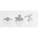 Three tanzanite dress rings, all stamped 925, ring sizes N - O.