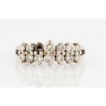 A two row diamond ring, set with two rows of graduated round brilliant cut diamonds (one stone