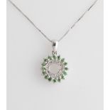 A green stone and diamond cluster pendant, on a chain, stamped 925.