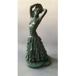 G. LEONARDI. A signed Art Deco green painted chalk semi-clad dancing figurine with tambourine,