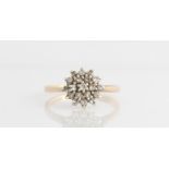 A hallmarked 9ct yellow gold diamond cluster ring, set with eight cut diamonds, total diamond weight