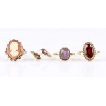 Four hallmarked 9ct yellow gold gemstone set rings, to include garnet, amethyst, cameo and pearl,
