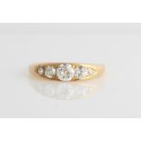 A Victorian 18ct yellow gold five stone diamond ring, set with five graduated old cut diamonds,