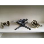 An anti-aircraft gun model with two canon models.