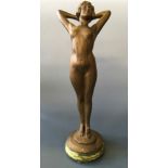 A bronze painted chalk nude female figurine, height 64cm, width 23cm.