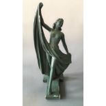 G. LEONARDI. An Art Deco green painted chalk semi-clad dancing figurine, signed near base and marked