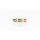 An emerald, sapphire, ruby and diamond half eternity ring, stamped 18k, ring size M.