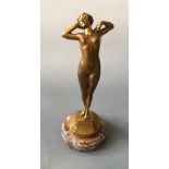 L. OURY. A signed gilt bronze Art Deco nude female figurine titled ‘Premier Trisson’, on marble