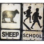 Two cast black and white warning signs, sheep and school.