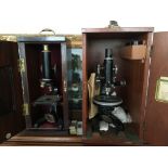 Two mahogany cases microscopes, with some slides.