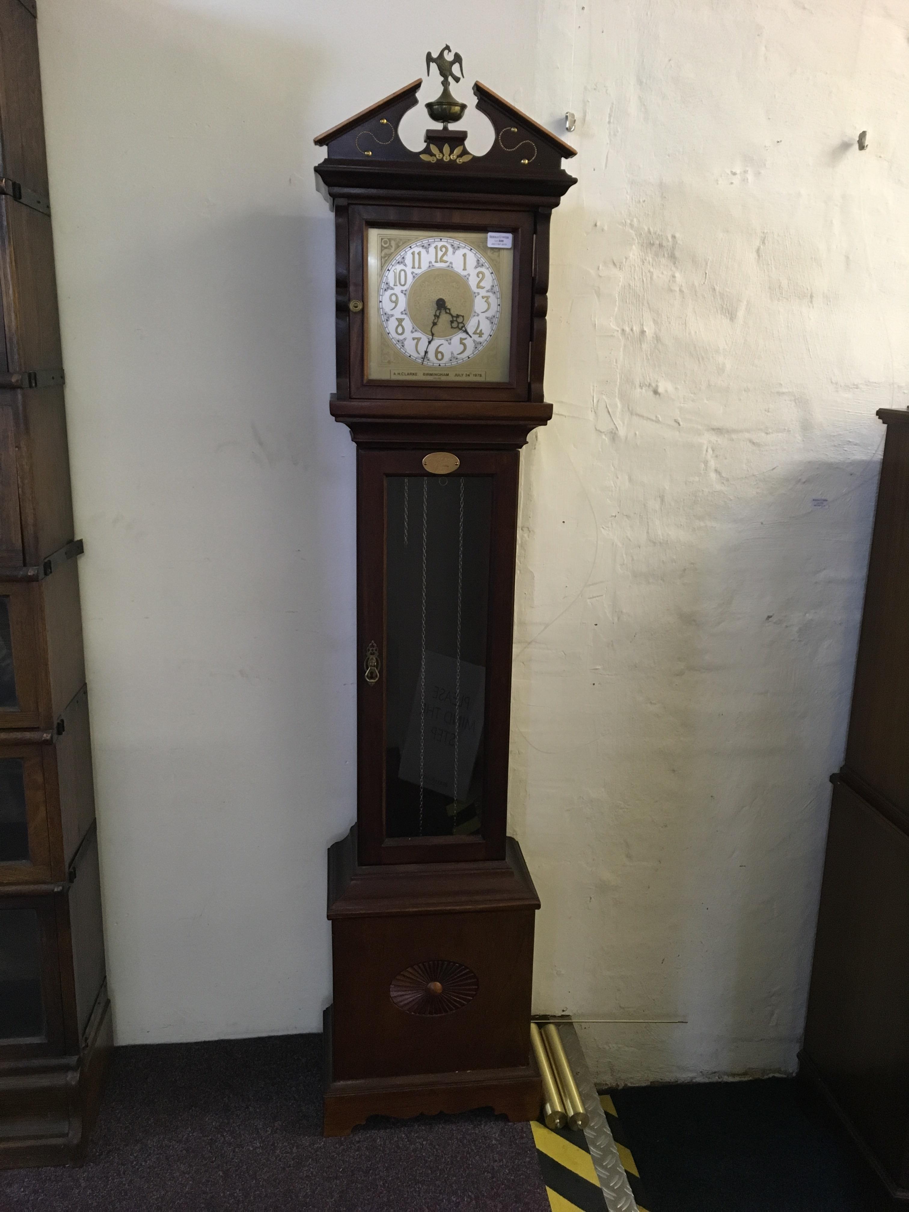 An A.H. Clarke Birmingham 1978 hall clock.