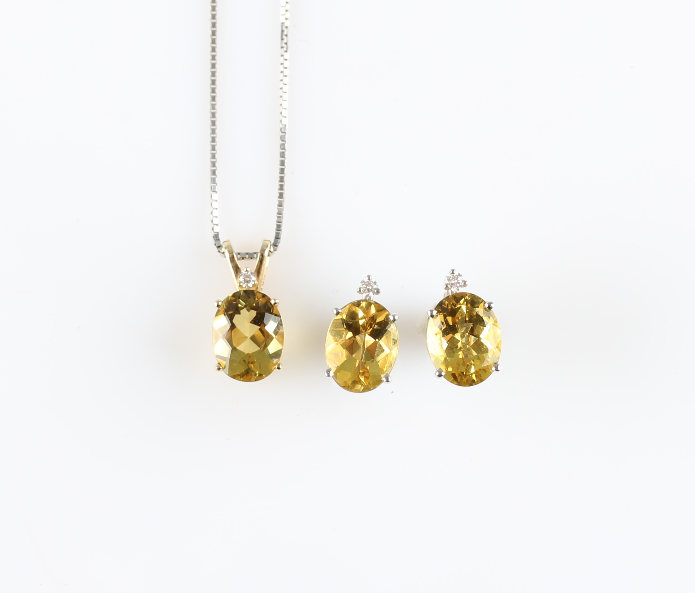 A lot to include a pair of yellow beryl / heliodor and diamond stud earrings, each set with an