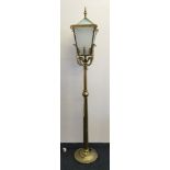 A brass lamp in the form of a street light.
