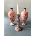 A pair of pink glass vases with painted floral design and an end of day glass candlestick, heights