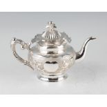 A late 19th/early 20th Century Chinese export silver teapot, the central textured section of body